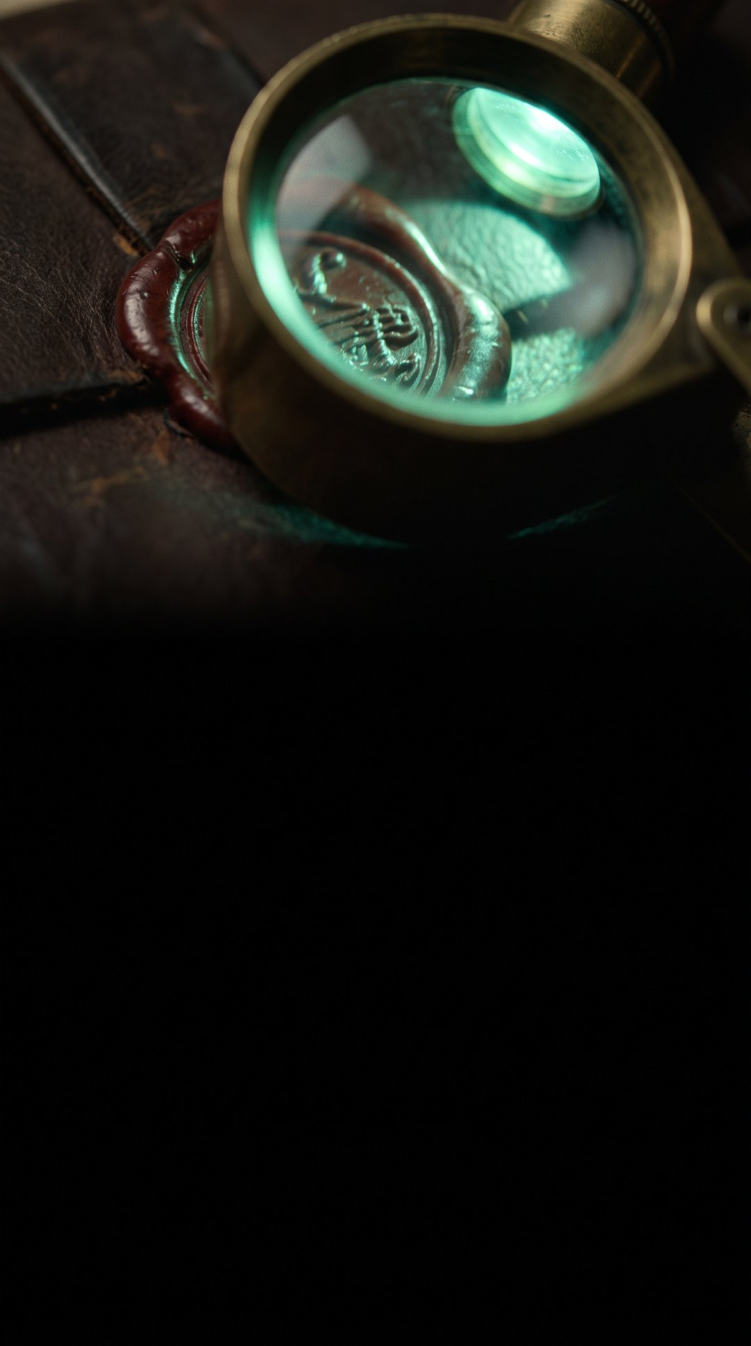A magnifying glass over a wax seal